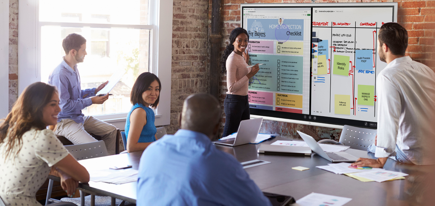 Woman using the Vibe Board for team training, facilitating interactive learning and engagement.